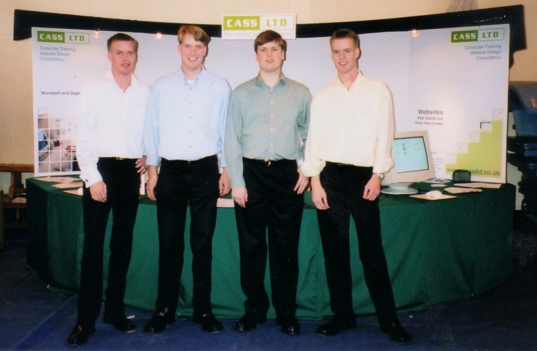 The Directors of CASS in front of the company stand at a computer fair The Directors of CASS in front of the company stand at a computer fair