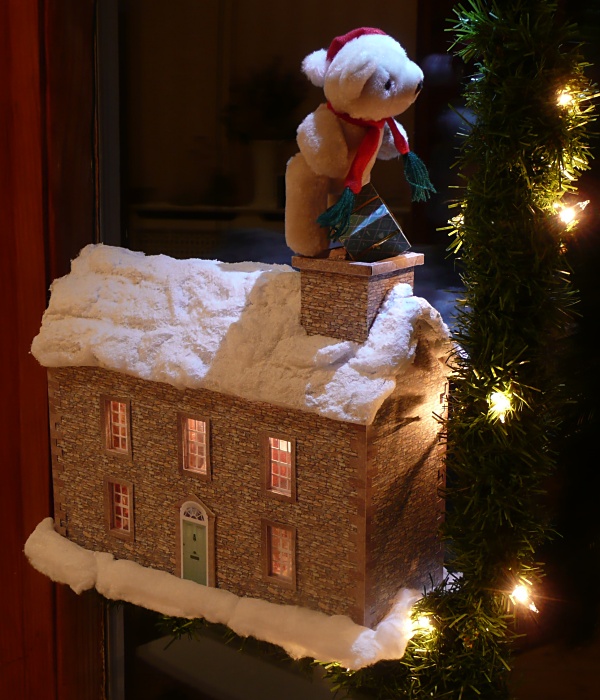 Santa Bear delivering a present Santa Bear delivering a present