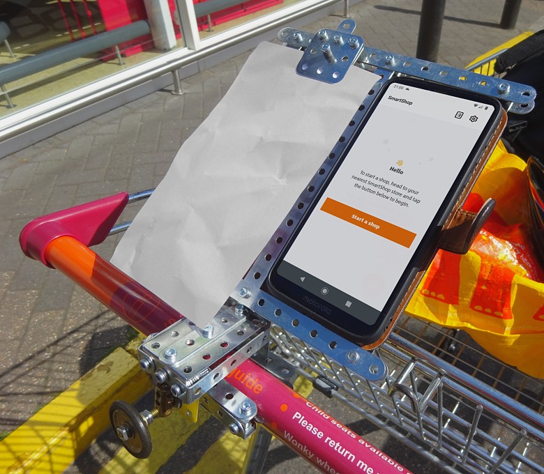 The smartphone holder mounted on a Sainsbury’s shopping trolley The smartphone holder mounted on a Sainsbury’s shopping trolley