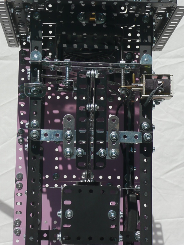 The coin slot, electromagnet and coin overflow hopper inside the right-hand tower